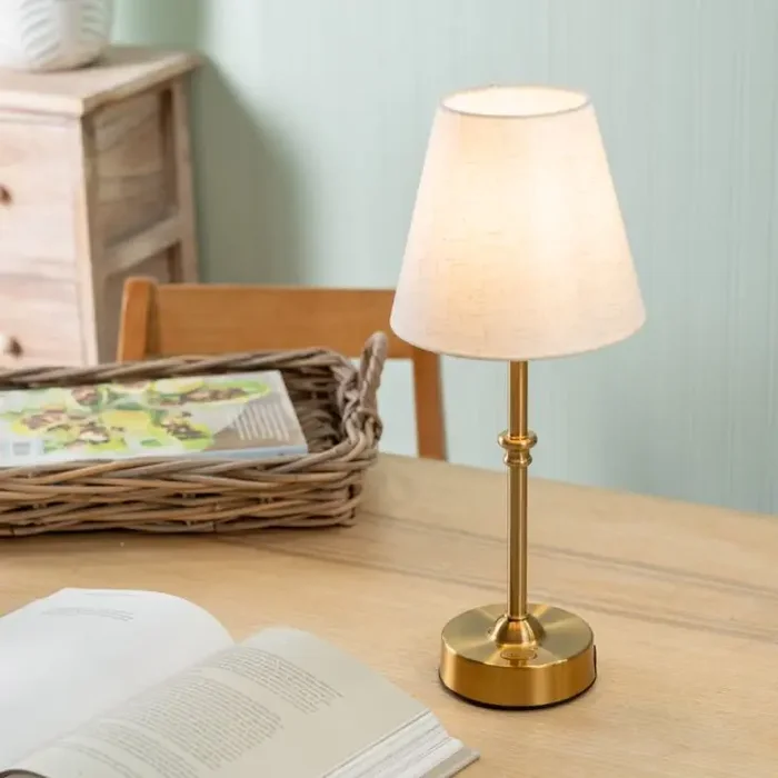 Lowe Rechargeable LED Table Lamp in Antique Brass With Natural White Cotton Shade.